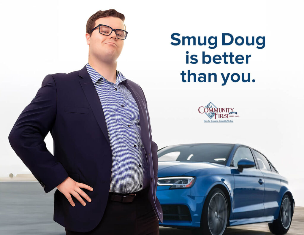 Smug man in front of a blue car